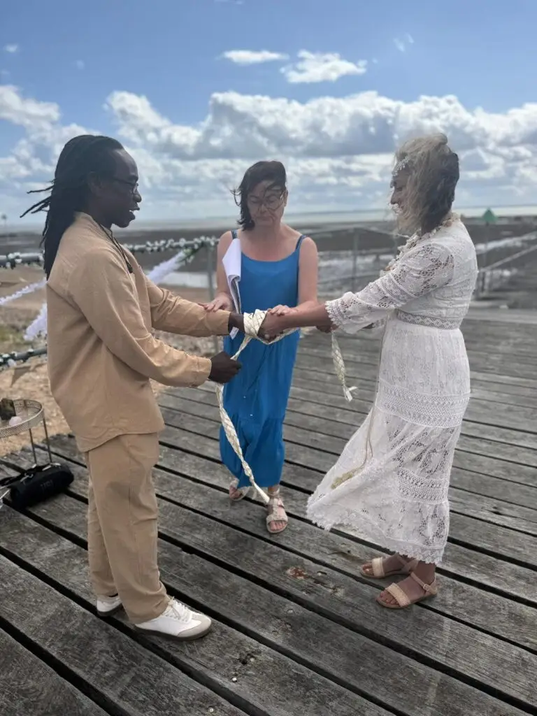 Bride and Groom completing handfasting ceremony